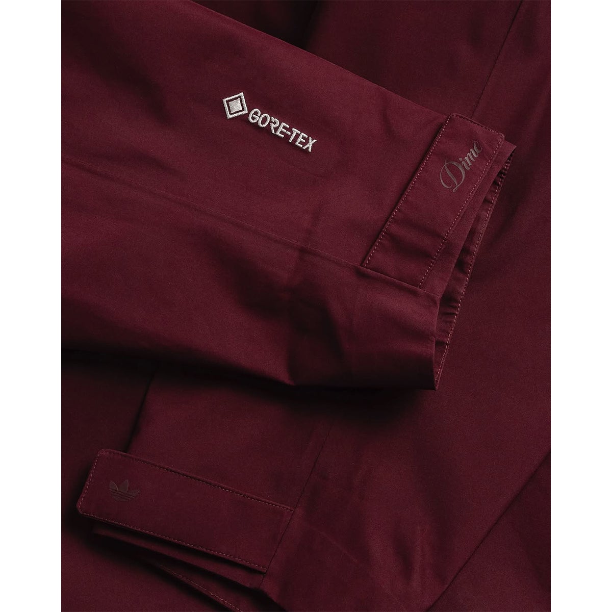 Adidas X Dime Gazelle Studded 3L Gore-Tex Jacket in Maroon Adidas X Dime Gazelle Studded 3L Gore-Tex Jacket in Maroon