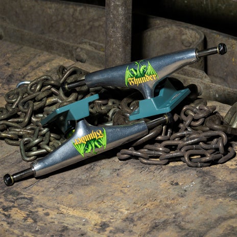 Thunder Medieval Script Team Edition Skateboard Trucks in Polished/Teal